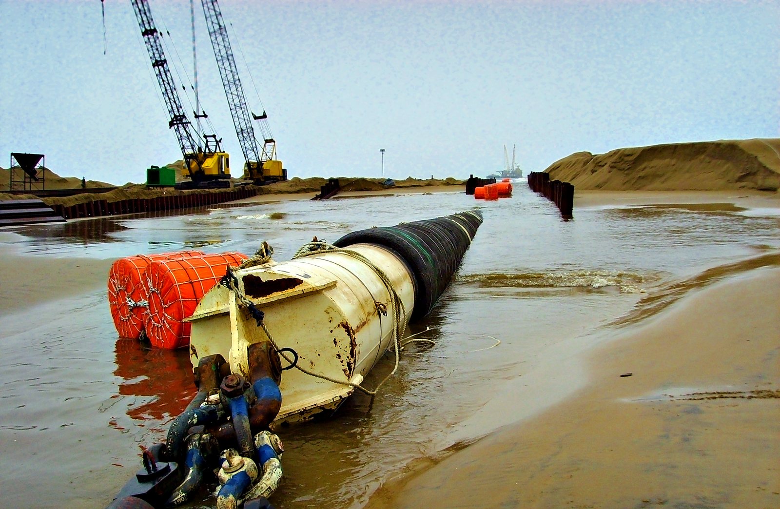 Pull head and buoyancy floats in a shore approach cofferdam