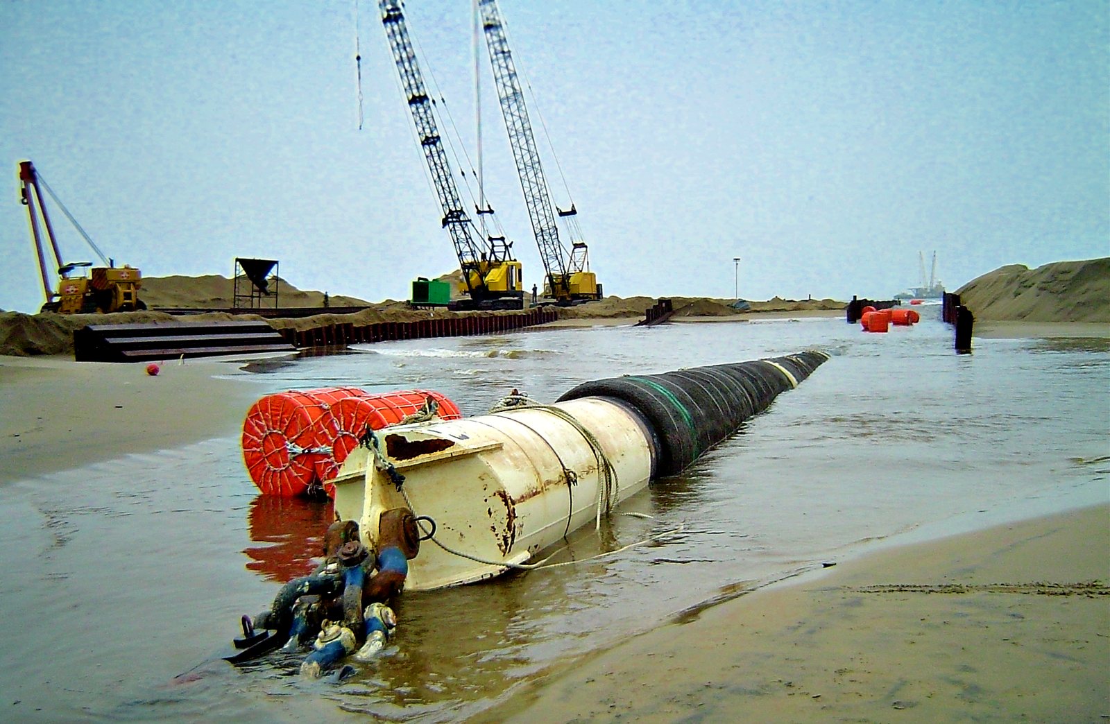 Pull head in the shore approach cofferdam with crawler cranes behind