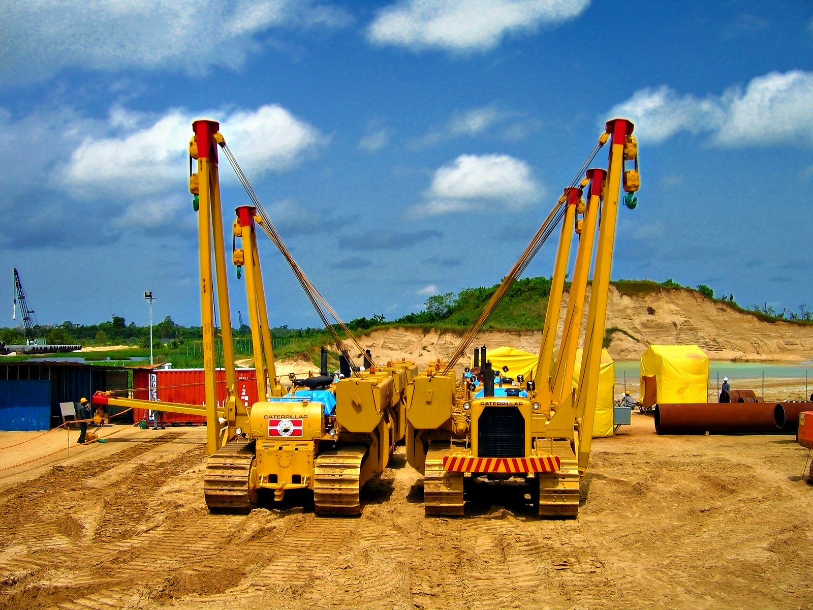 Two sideboom tractors on the right-of-way